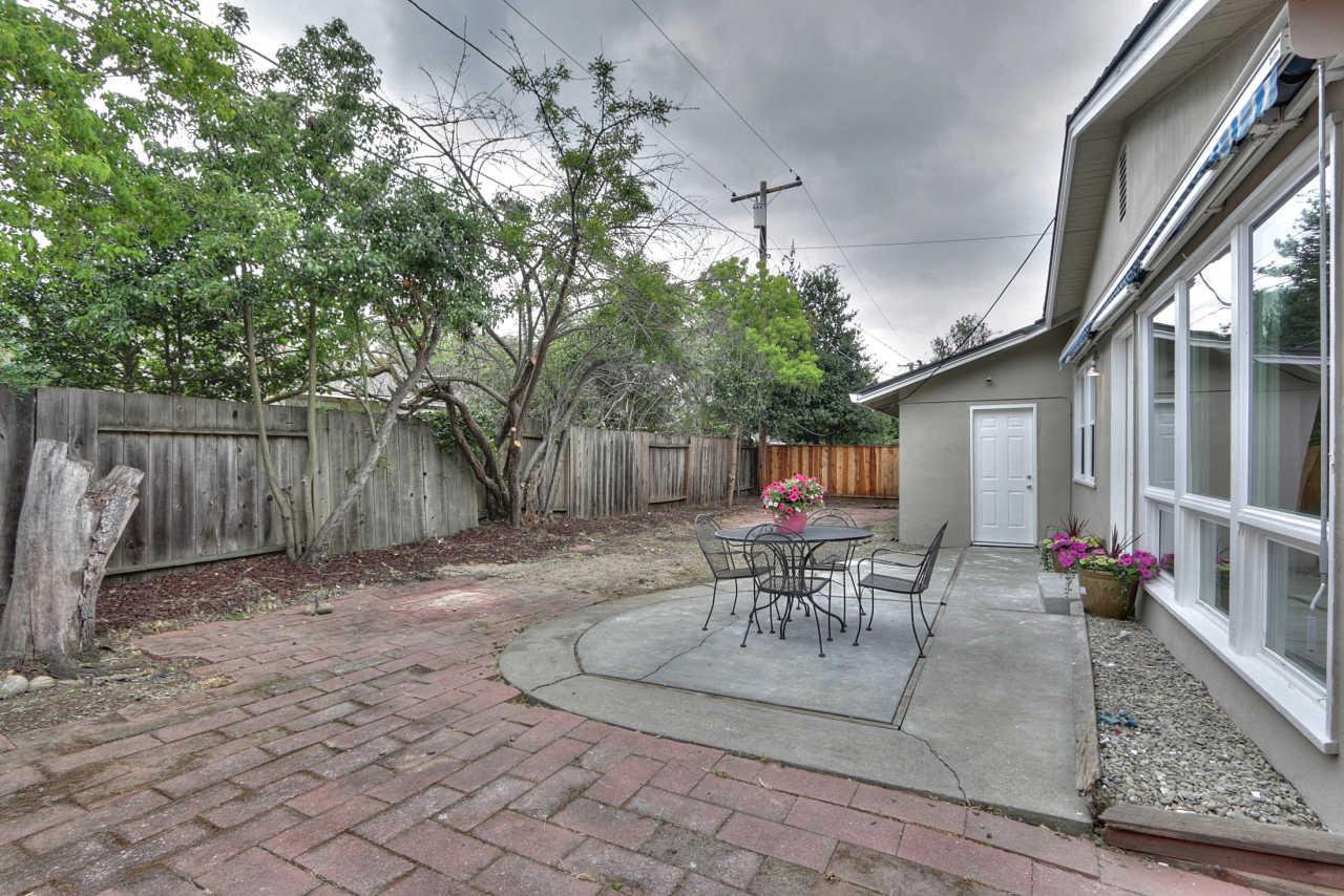 1350 Phyllis Avenue Mountain View, CA 94040 - Photo 24 of 27 a view of a patio with table and chairs potted plants and large tree