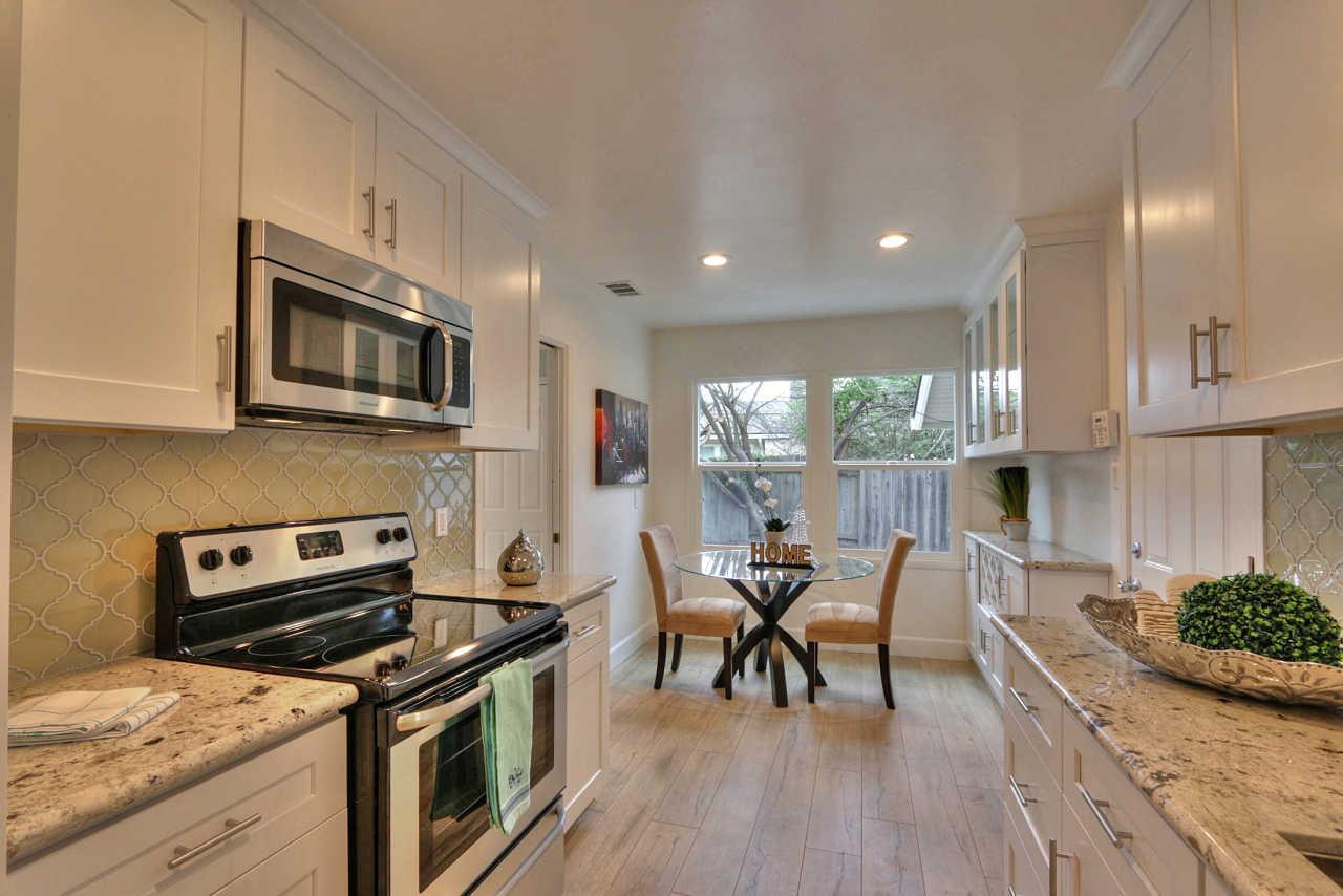 1350 Phyllis Avenue Mountain View, CA 94040 - Photo 3 of 27 a kitchen with stainless steel appliances granite countertop wooden cabinets a stove top oven a sink and dishwasher