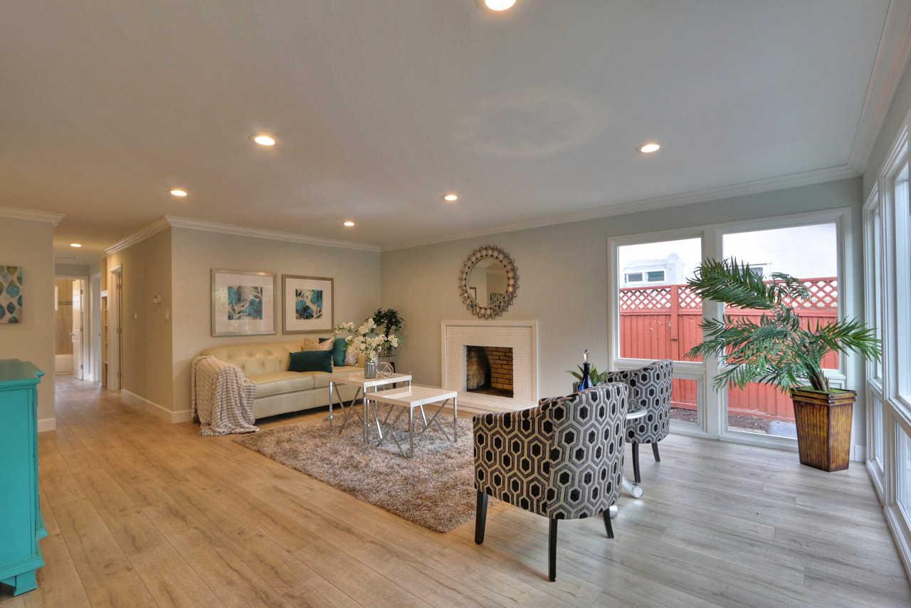 1350 Phyllis Avenue Mountain View, CA 94040 - Photo 10 of 27 a living room with furniture a potted plant and a fireplace