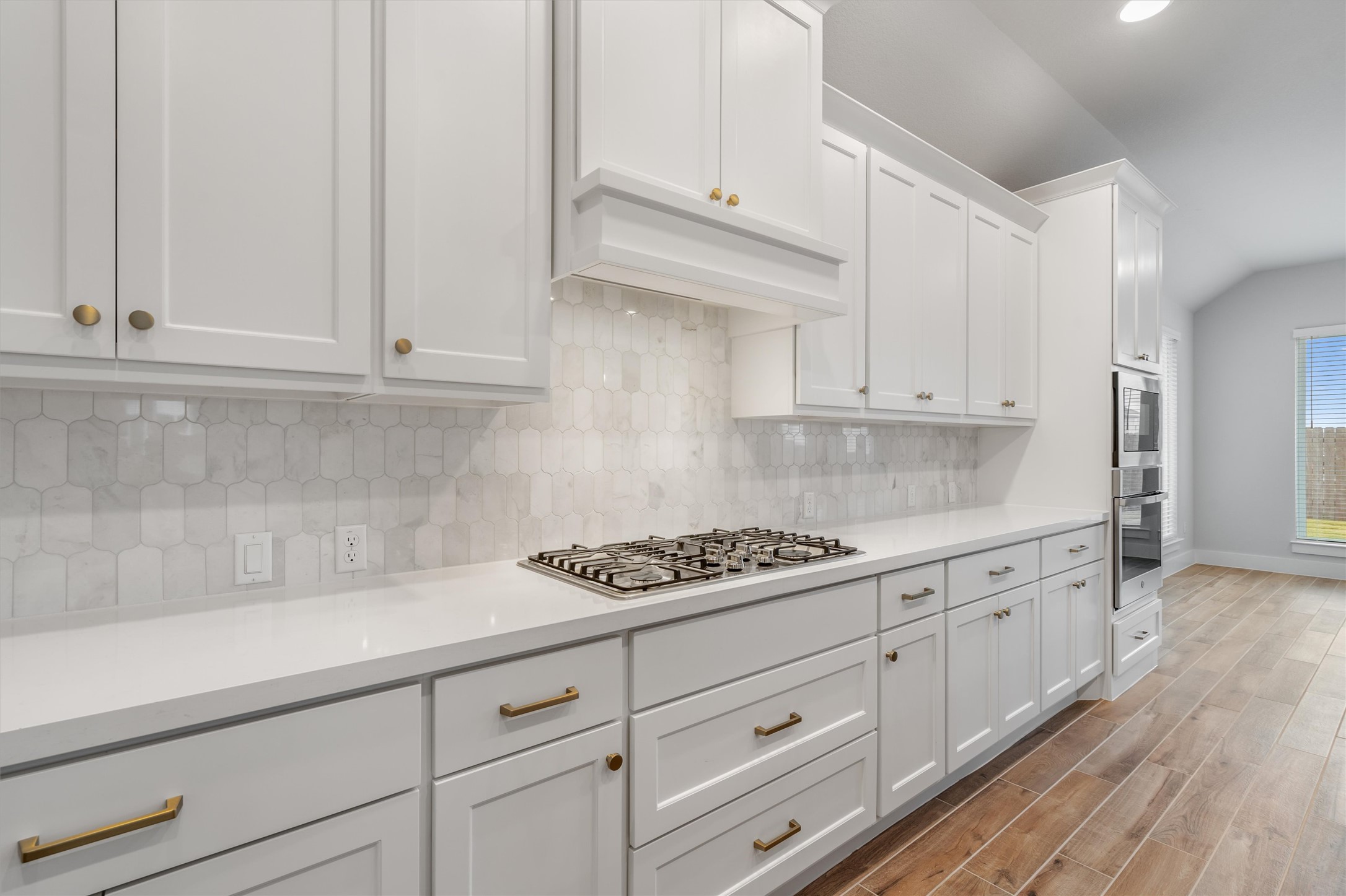 8516 Picnic House Path Austin, TX 78744 - Photo 13 of 39 a kitchen with granite countertop white cabinets and white appliances