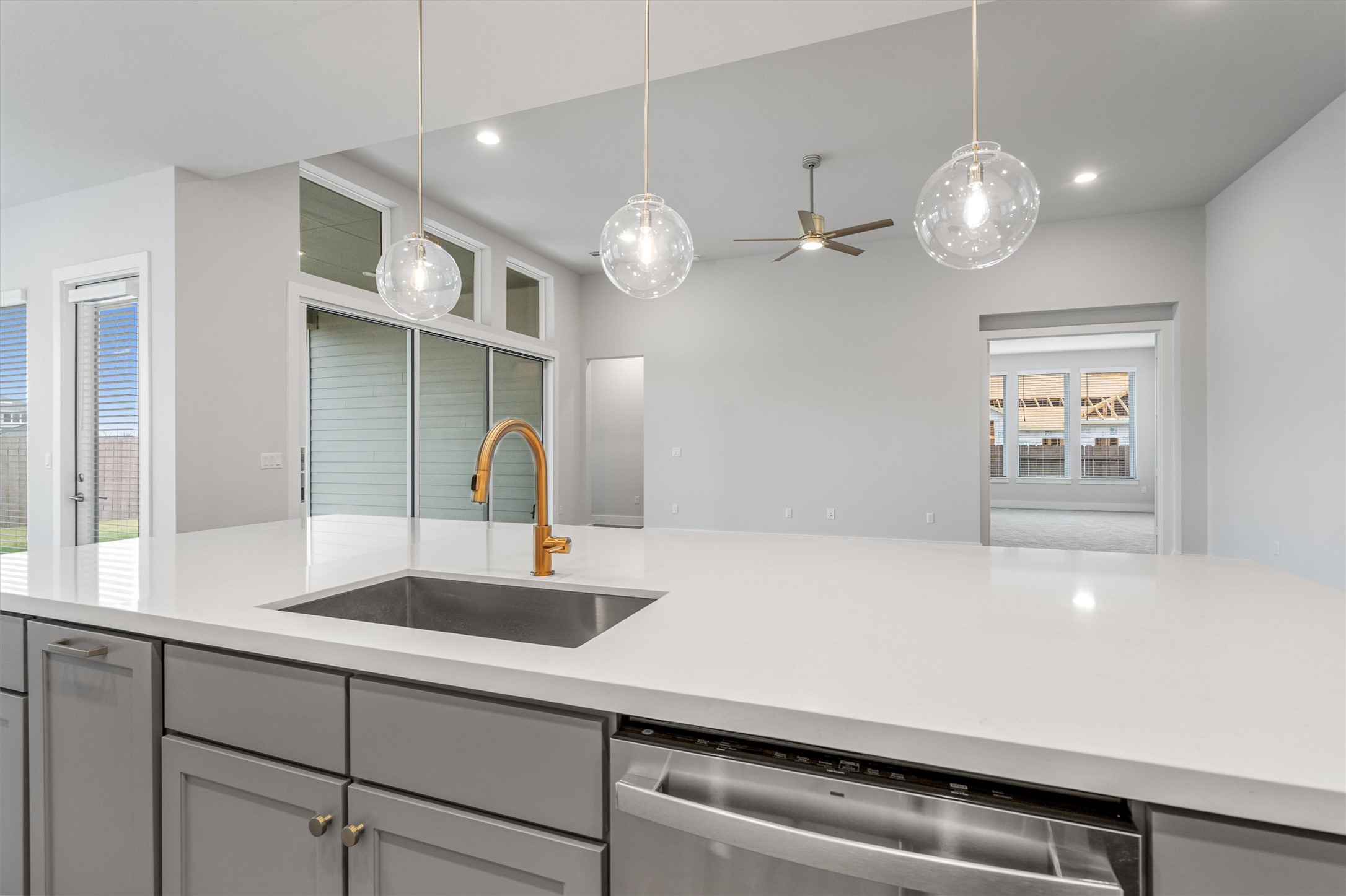 8516 Picnic House Path Austin, TX 78744 - Photo 39 of 39 a kitchen with a sink and a chandelier
