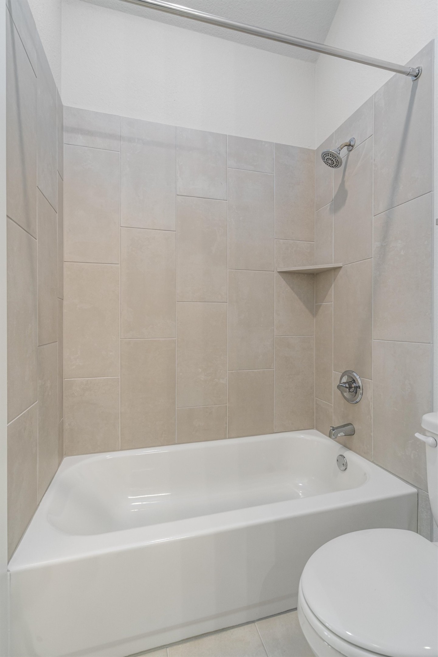 8516 Picnic House Path Austin, TX 78744 - Photo 25 of 39 a bathroom with a bathtub and a toilet