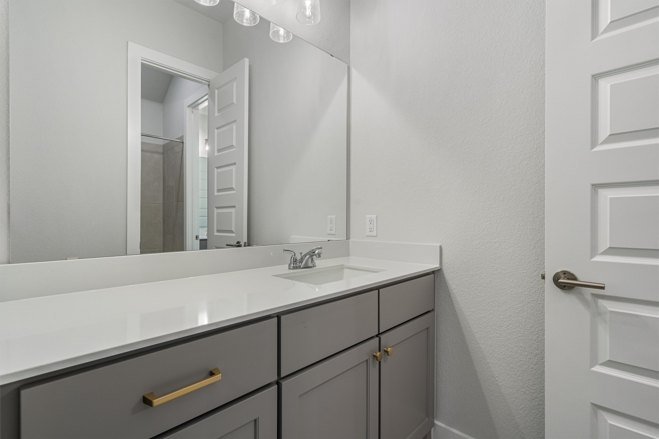 8516 Picnic House Path Austin, TX 78744 - Photo 26 of 39 a bathroom with a sink and a mirror
