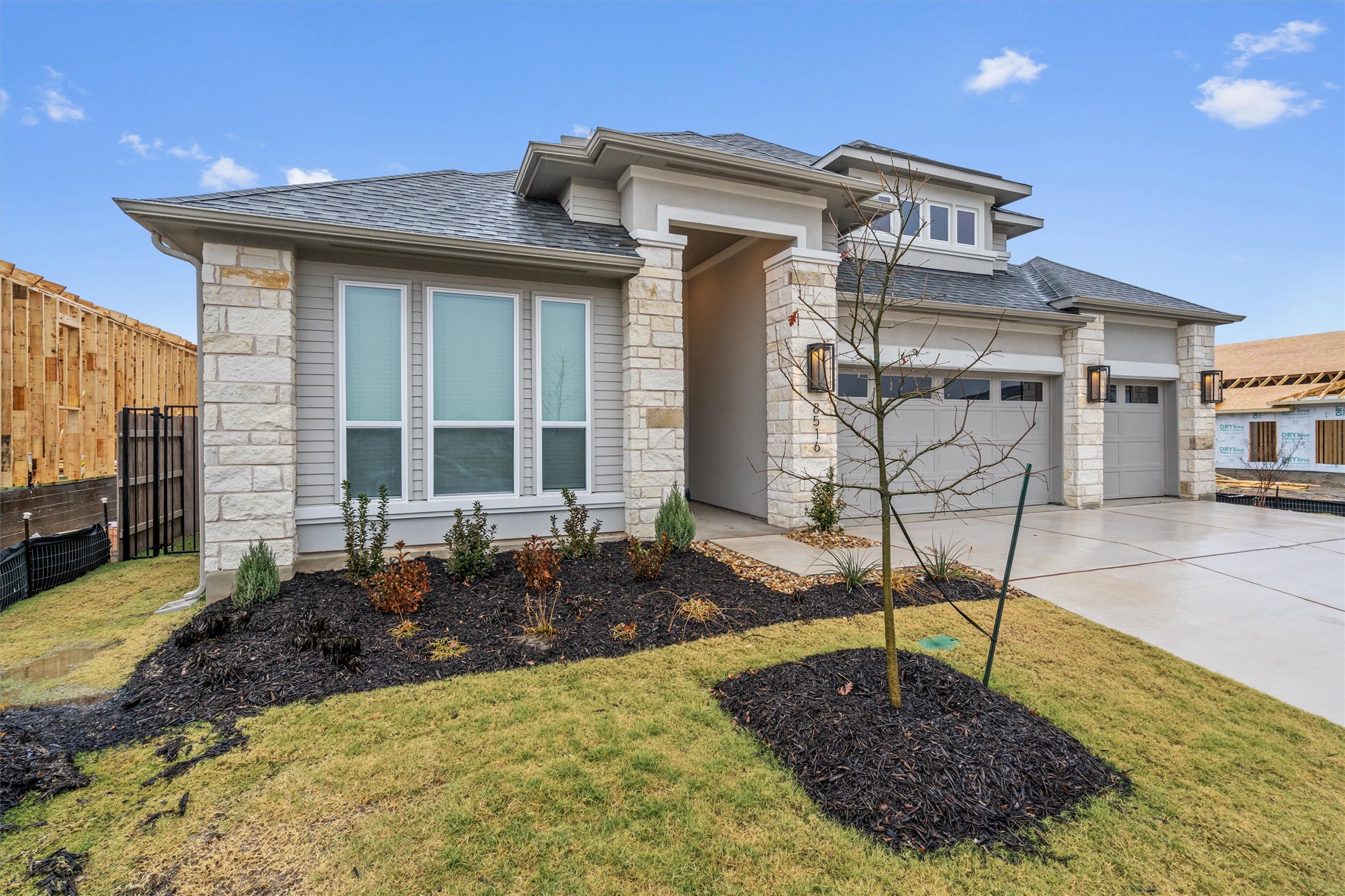 8516 Picnic House Path Austin, TX 78744 - Photo 3 of 39 a front view of a house with garden
