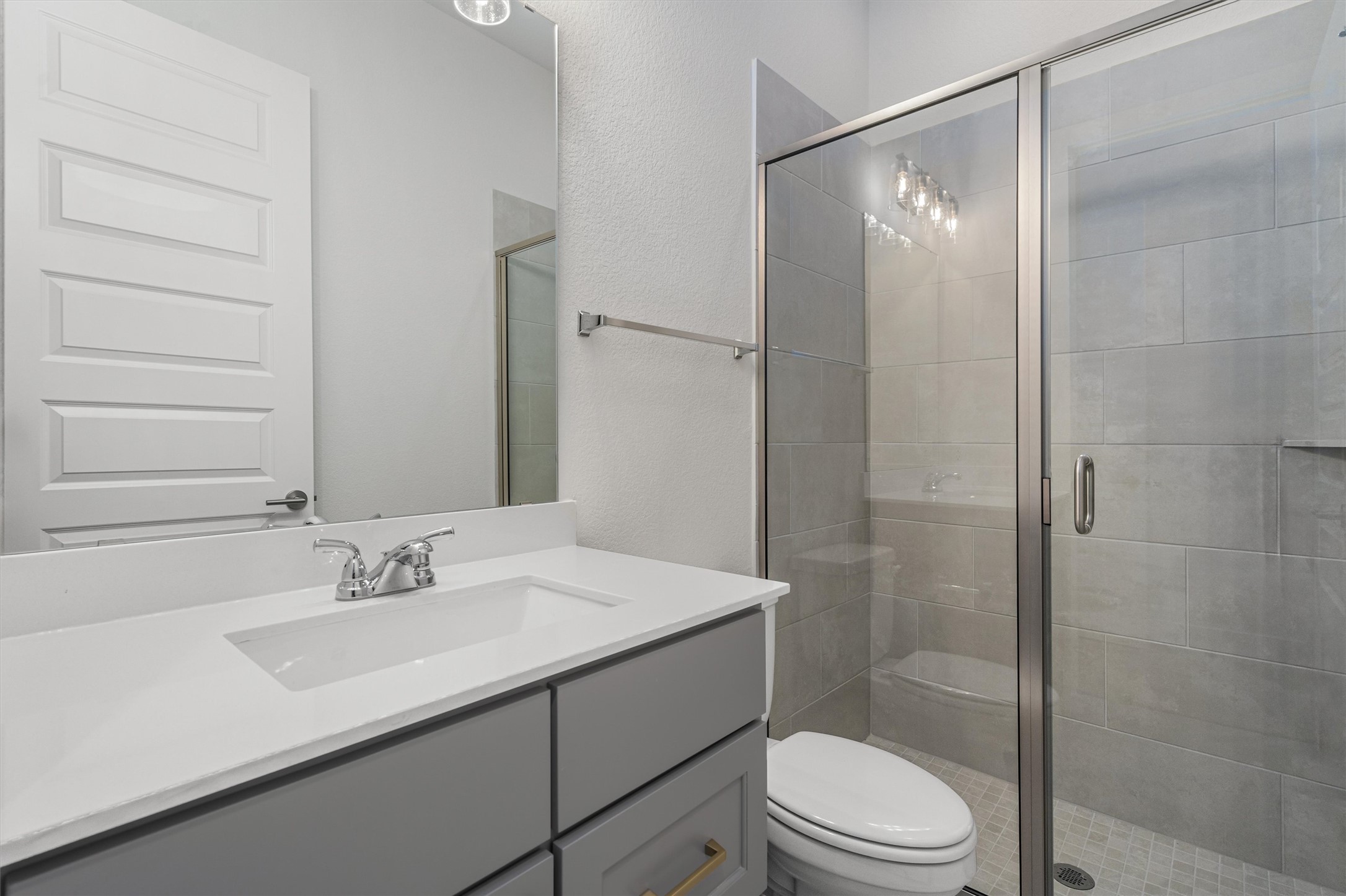 8516 Picnic House Path Austin, TX 78744 - Photo 32 of 39 a bathroom with a sink a toilet and shower