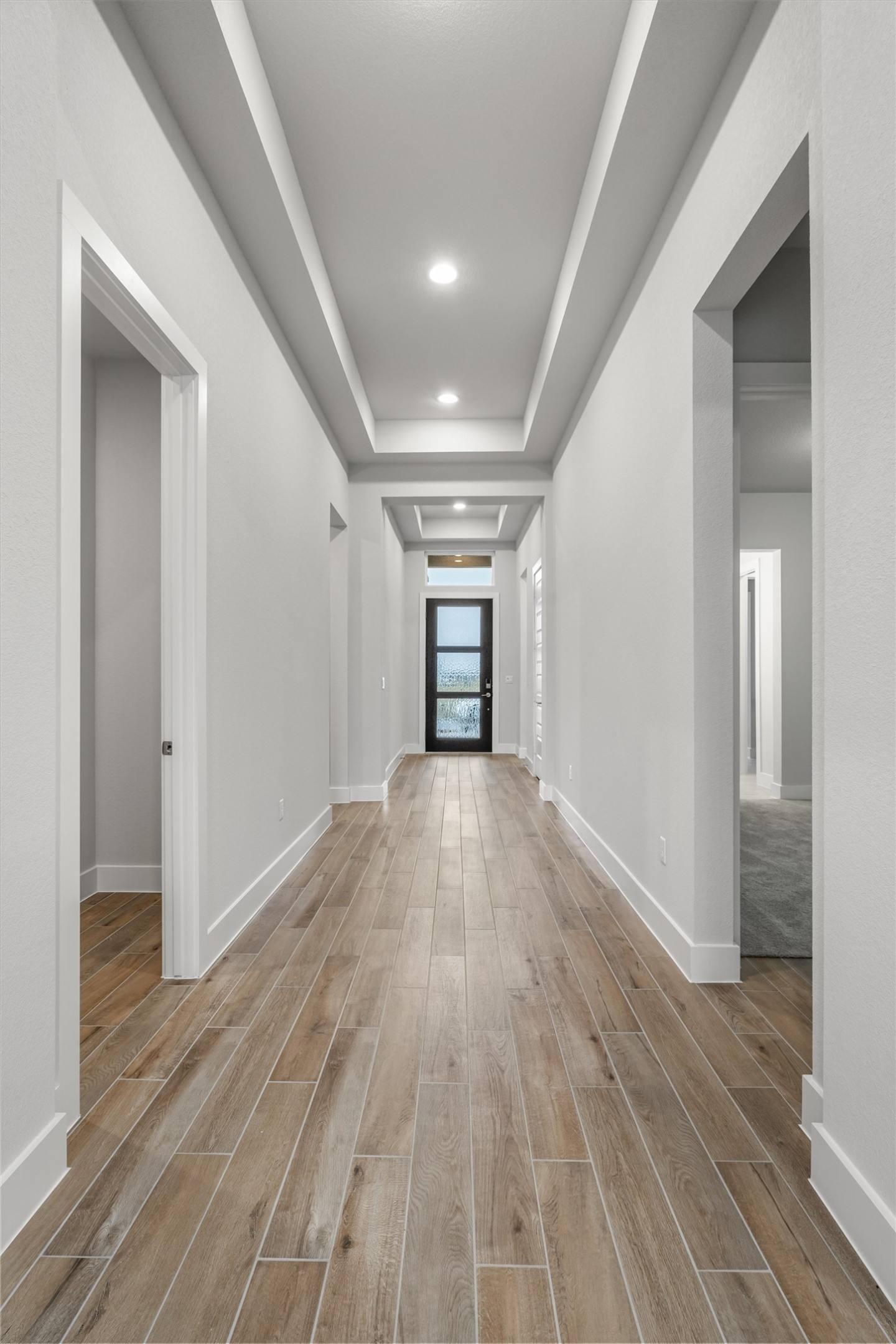 8516 Picnic House Path Austin, TX 78744 - Photo 8 of 39 a view of empty room with wooden floor