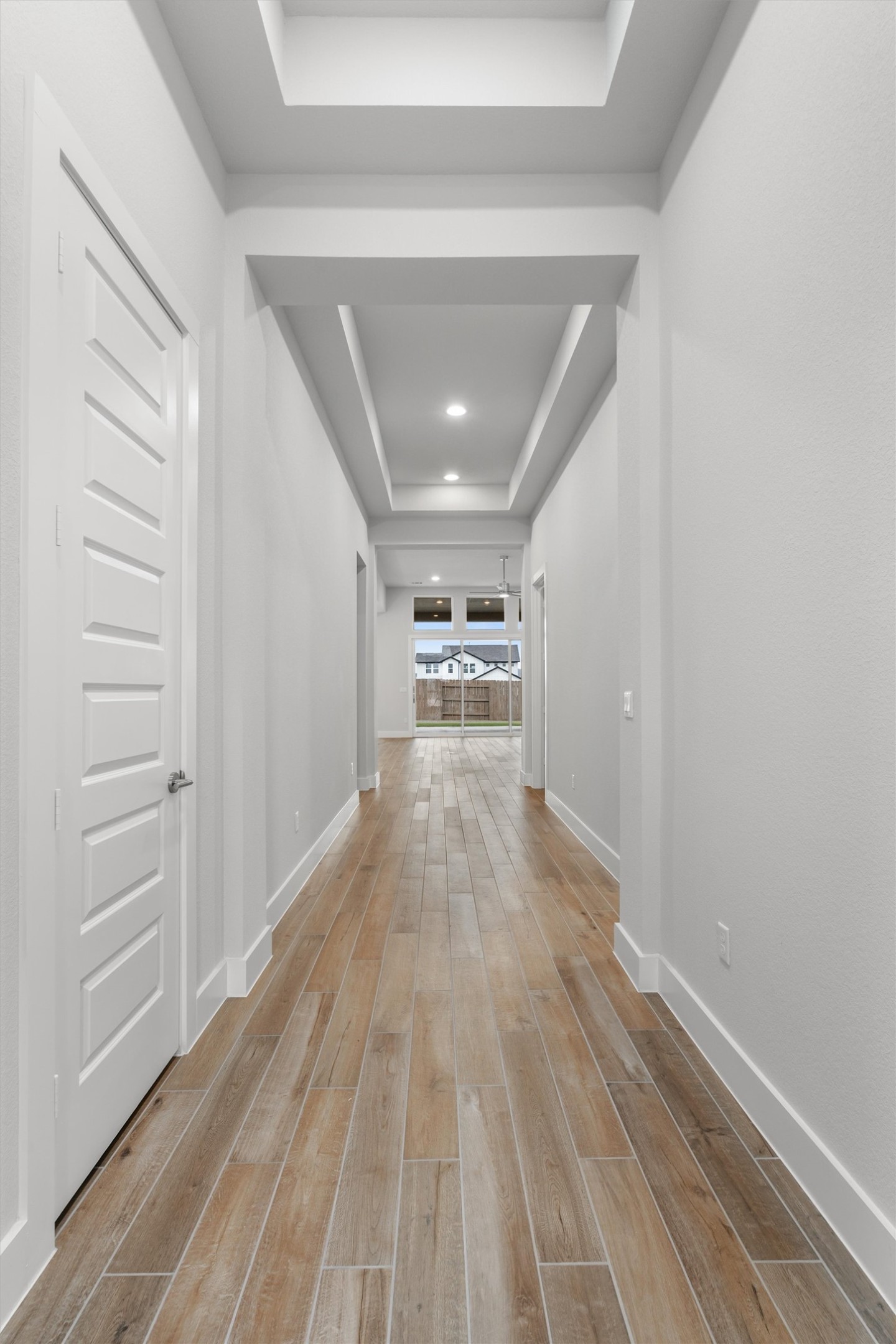 8516 Picnic House Path Austin, TX 78744 - Photo 9 of 39 a view of empty room with wooden floor
