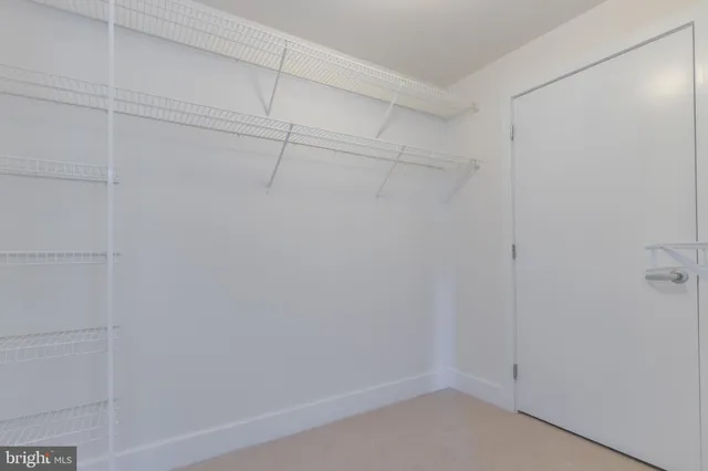 a living room with furniture large window and flat screen tv
