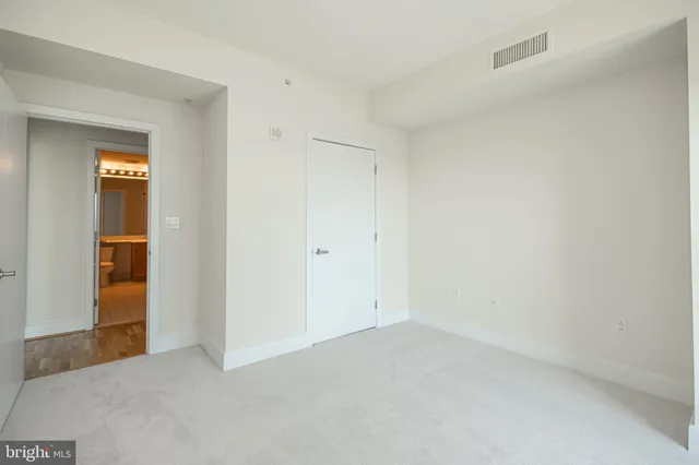 a view of a dining room with furniture wooden floor and chandelier