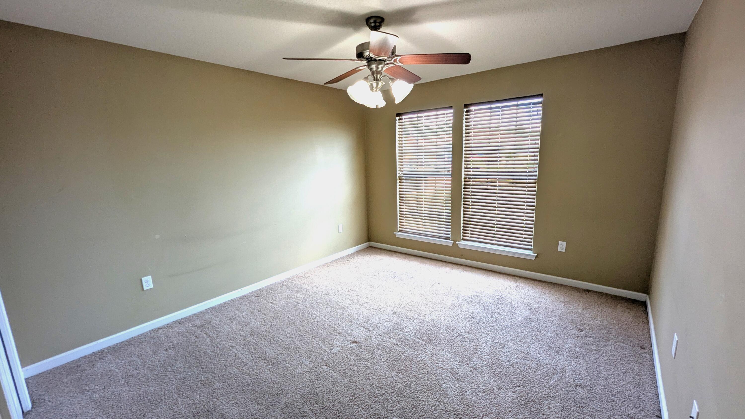 7976 Promise Creek Road Navarre, FL 32566 - Photo 14 of 29 a view of an empty room with a window