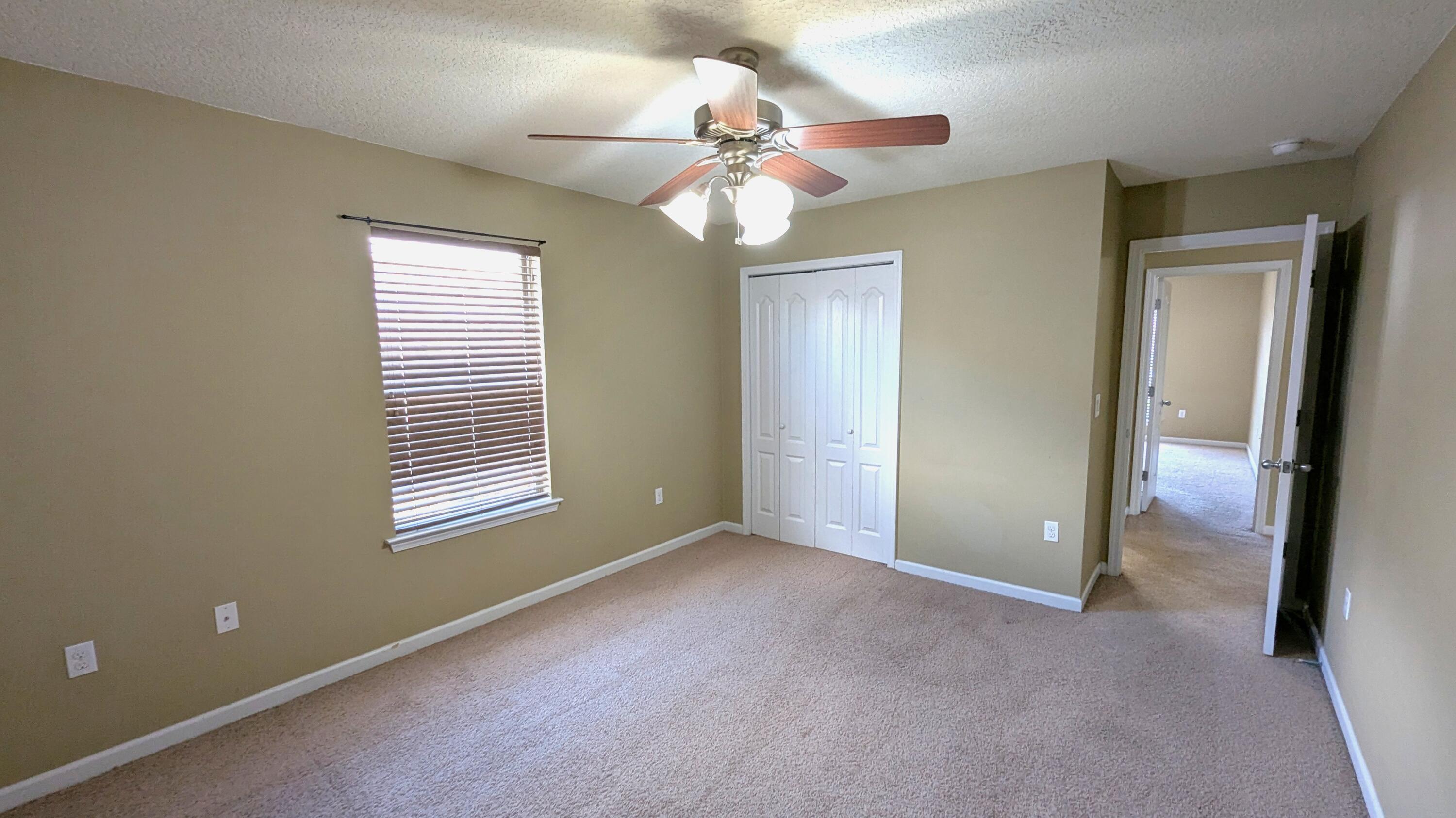 7976 Promise Creek Road Navarre, FL 32566 - Photo 16 of 29 a view of an empty room with a window