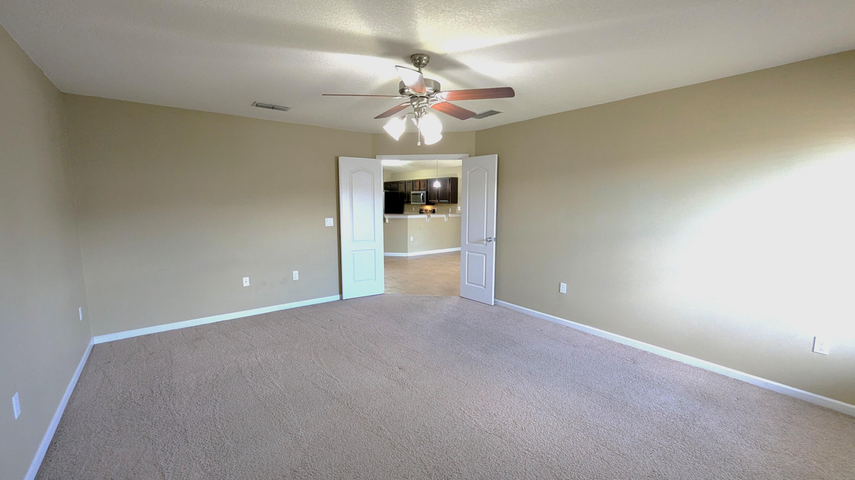 7976 Promise Creek Road Navarre, FL 32566 - Photo 21 of 29 a view of an empty room with a window