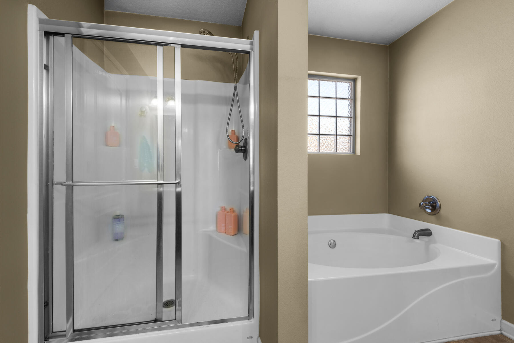 7976 Promise Creek Road Navarre, FL 32566 - Photo 23 of 29 a bathroom with a bathtub and a shower