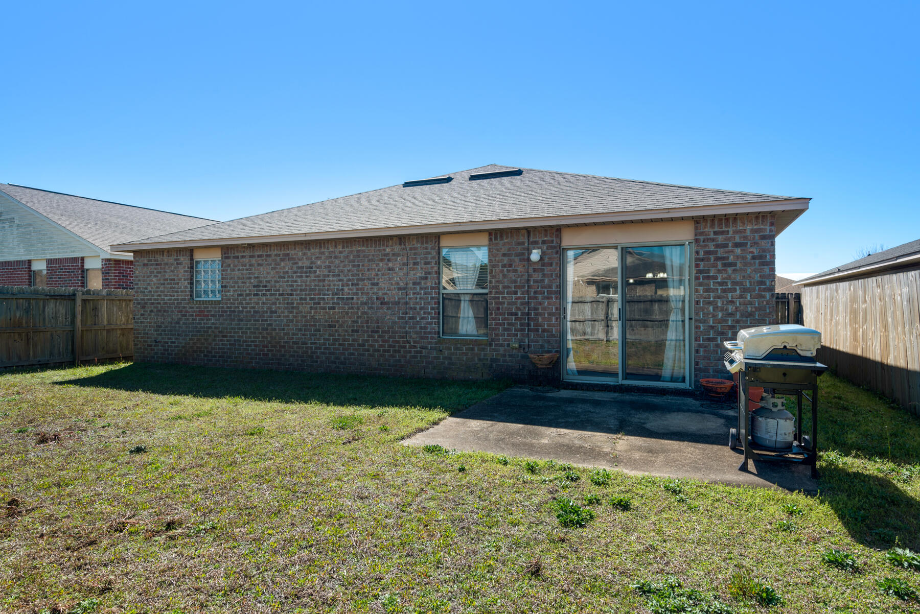 7976 Promise Creek Road Navarre, FL 32566 - Photo 27 of 29 a backyard of a house