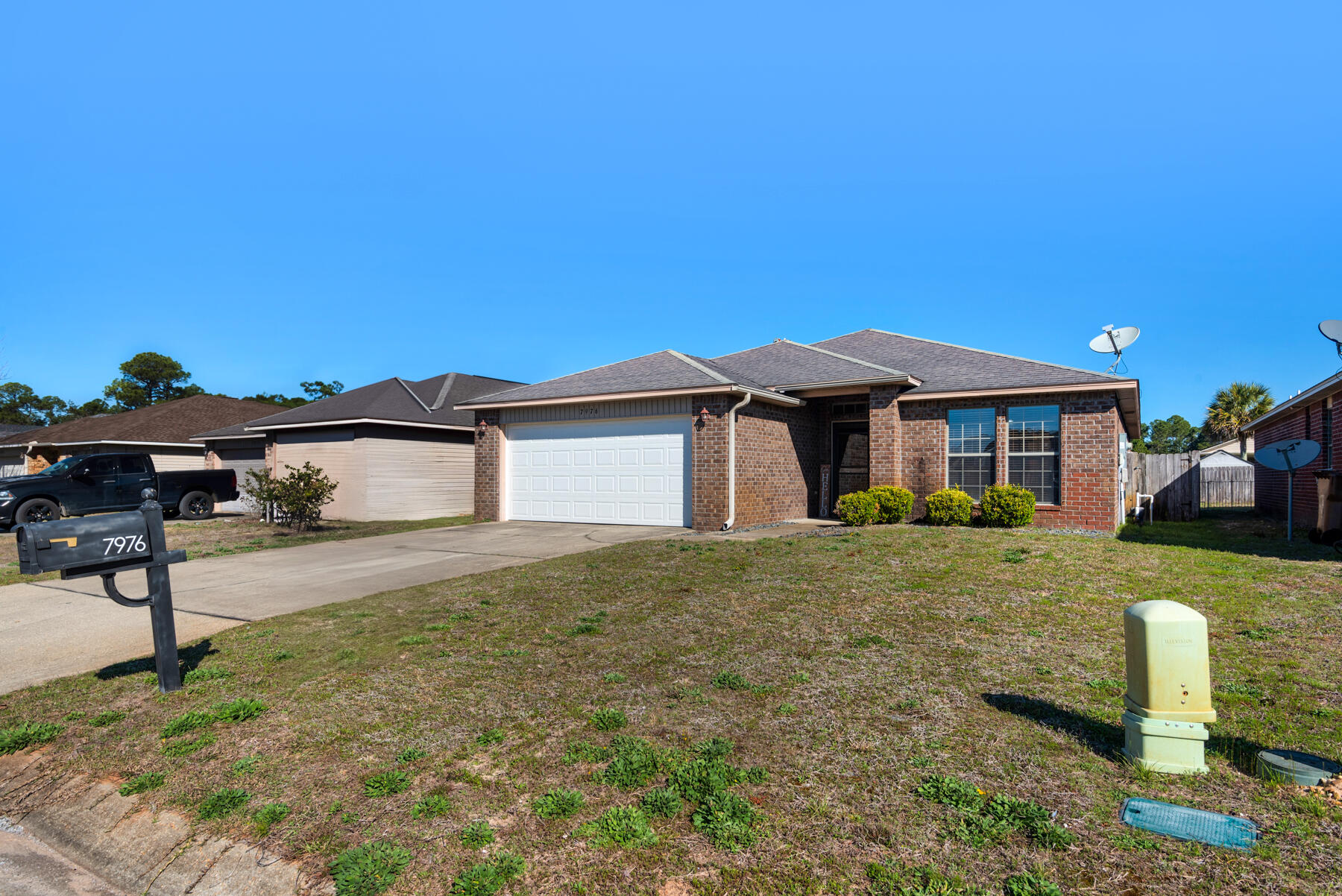 7976 Promise Creek Road Navarre, FL 32566 - Photo 4 of 29 a front view of a house with a yard