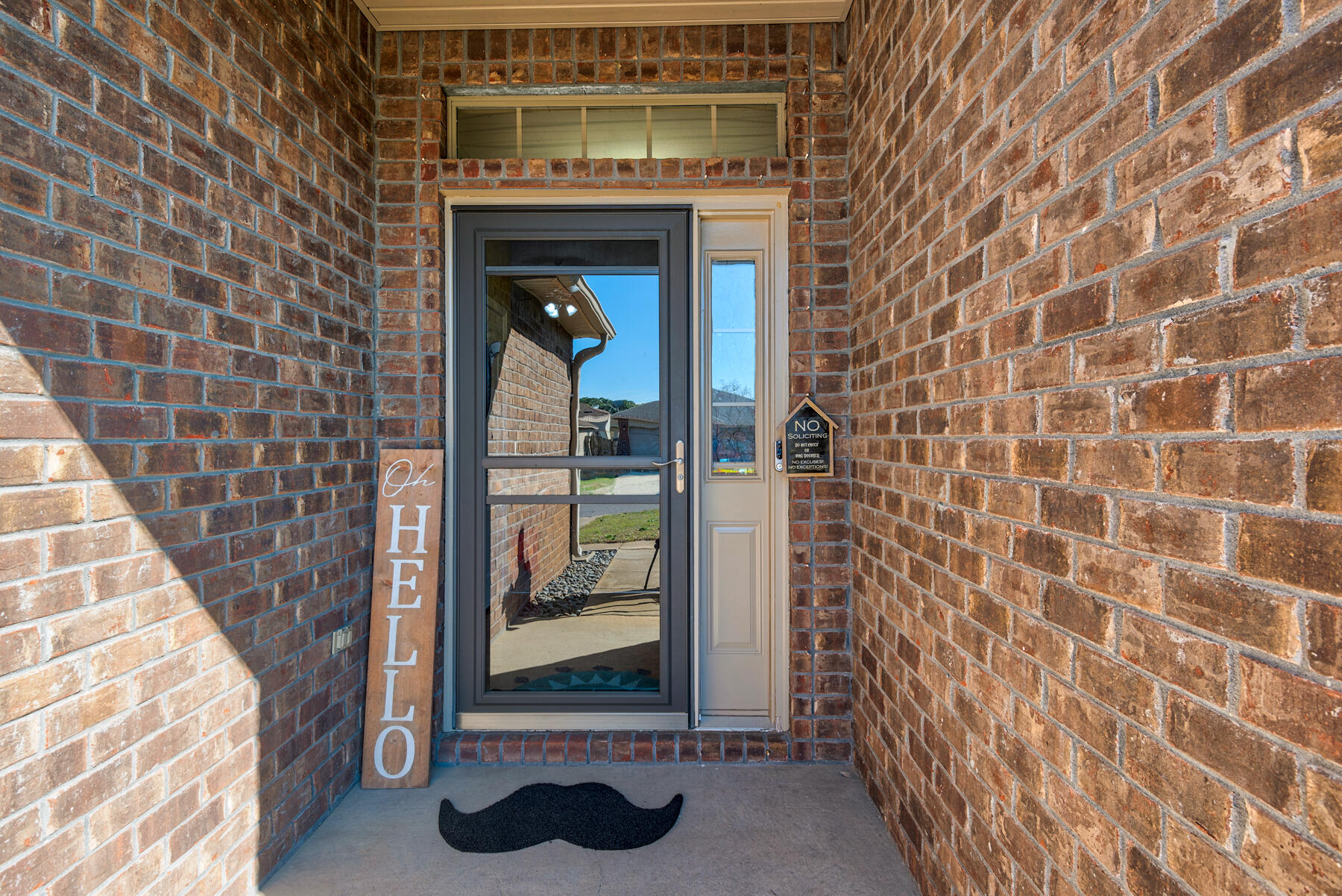 7976 Promise Creek Road Navarre, FL 32566 - Photo 6 of 29 a front view of a house with a door