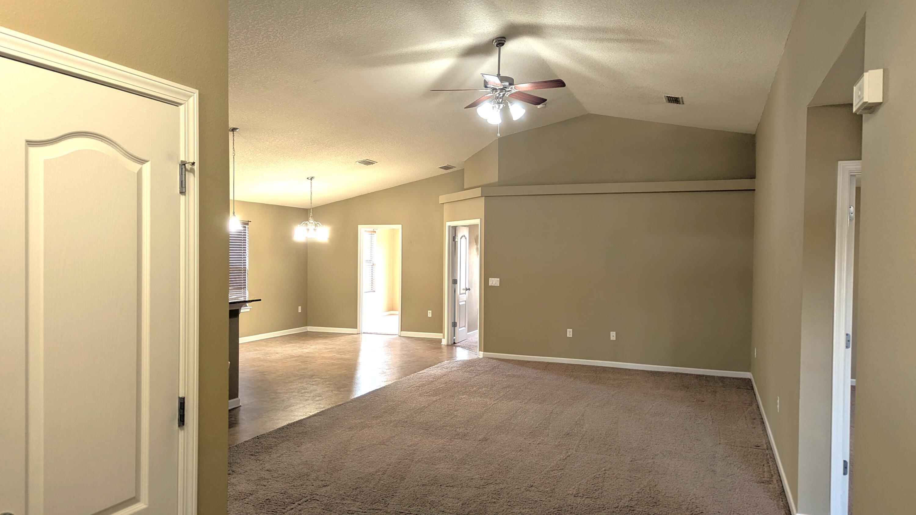 7976 Promise Creek Road Navarre, FL 32566 - Photo 7 of 29 a view of a hallway with a bathroom