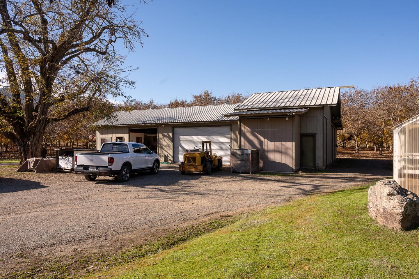 3385 Hecker Pass Road Gilroy, CA 95020 - Photo 12 of 18 a view of a house with a patio and a yard