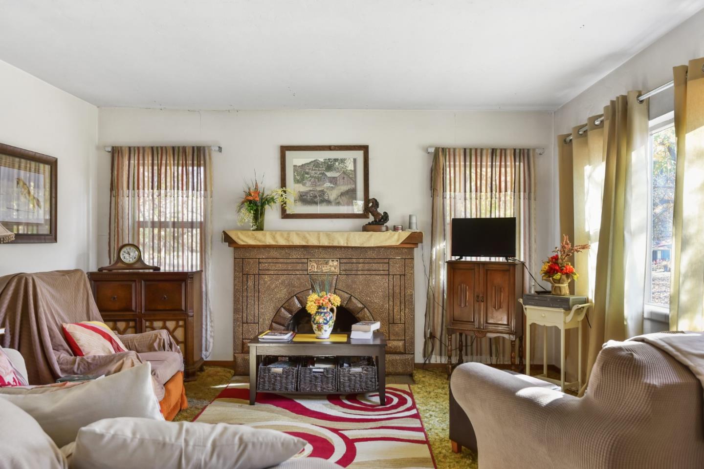 3385 Hecker Pass Road Gilroy, CA 95020 - Photo 3 of 18 a living room with furniture and a fireplace