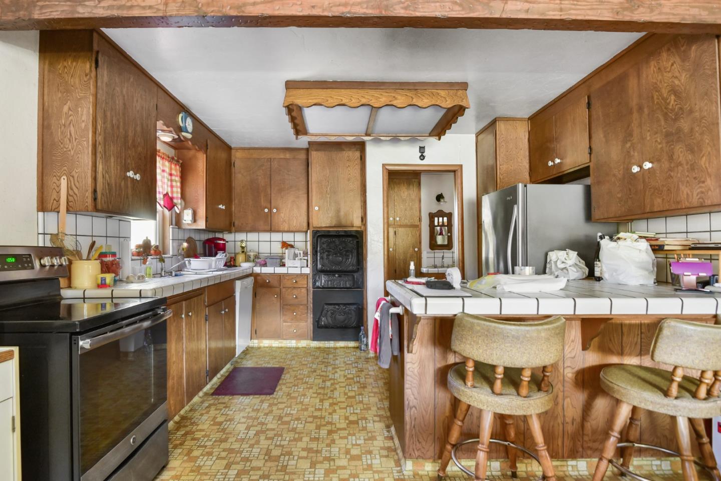 3385 Hecker Pass Road Gilroy, CA 95020 - Photo 5 of 18 a kitchen with a sink and chairs