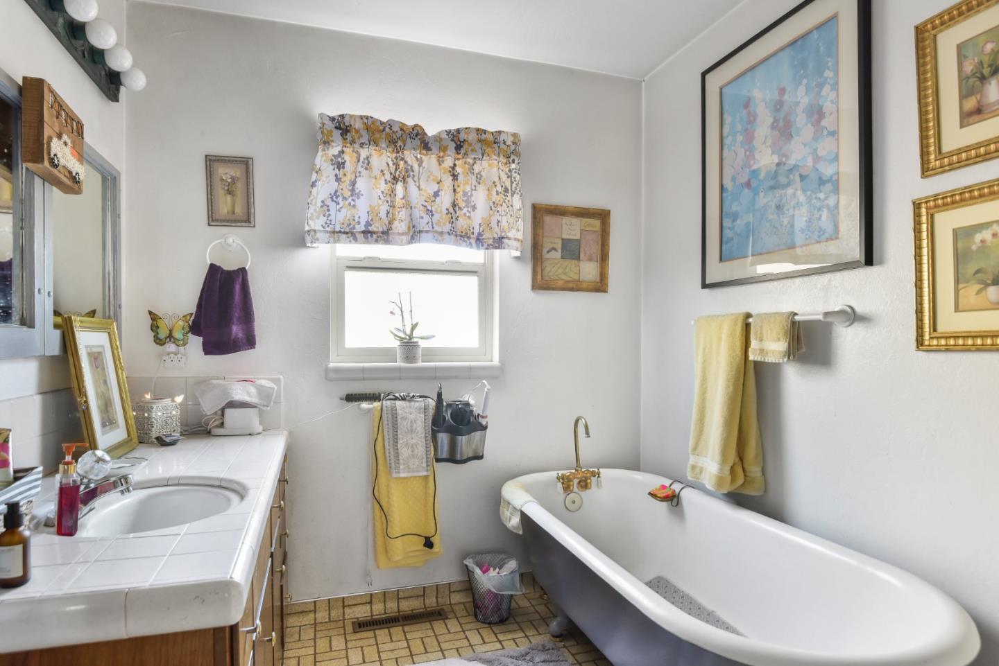 3385 Hecker Pass Road Gilroy, CA 95020 - Photo 7 of 18 a bathroom with a tub sink and mirror