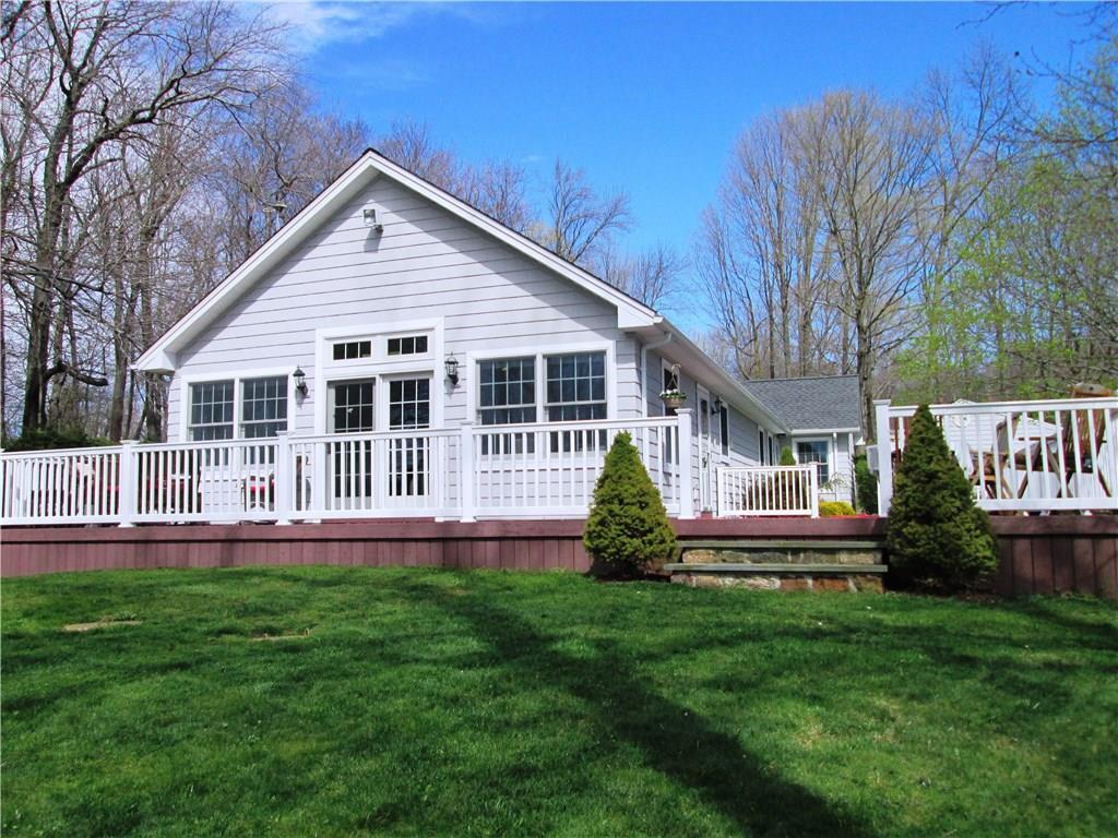 616 Wolcott Road Bristol, CT 06010 - Photo 1 of 1 Lake side of house showing expansive deck