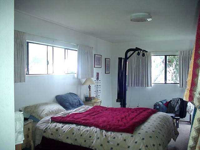 68 Maukanani Road Kula, HI 96790 - Photo 8 of 8 a bedroom with a bed and a window