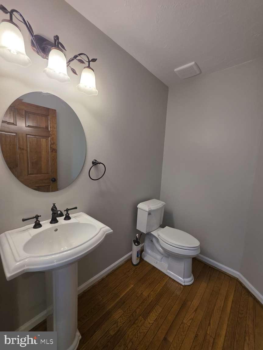 798 Menges Mills Road Spring Grove, PA 17362 - Photo 11 of 50 a bathroom with a sink a toilet and mirror