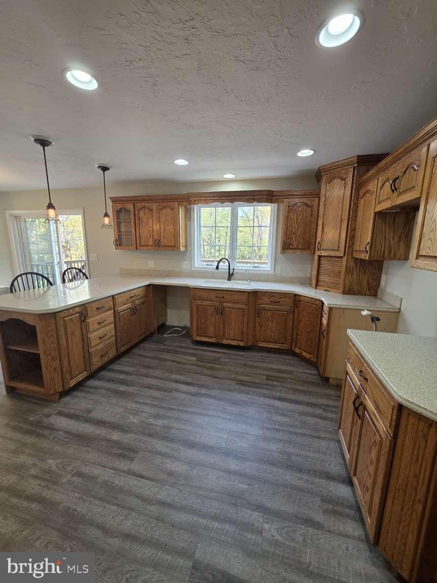 798 Menges Mills Road Spring Grove, PA 17362 - Photo 15 of 50 a large kitchen with wooden floors and a sink