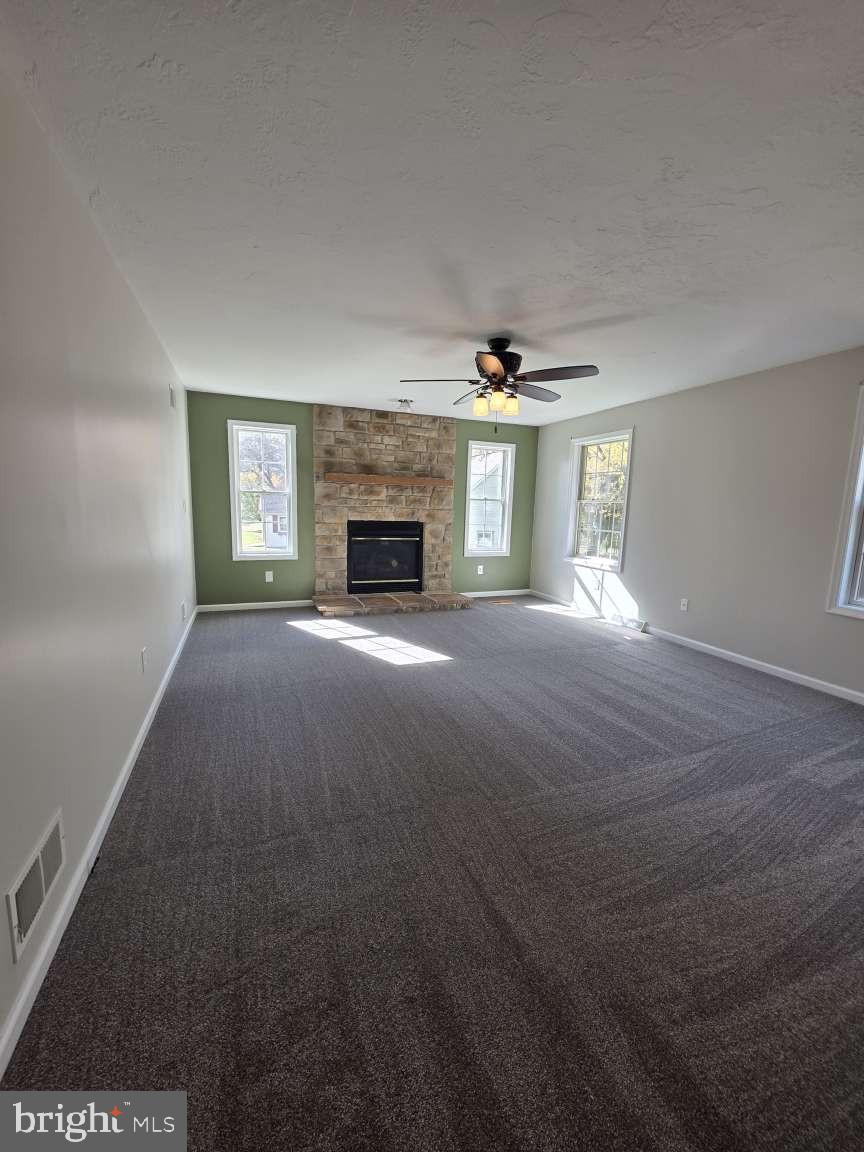 798 Menges Mills Road Spring Grove, PA 17362 - Photo 17 of 50 a view of an empty room with a fireplace and a window