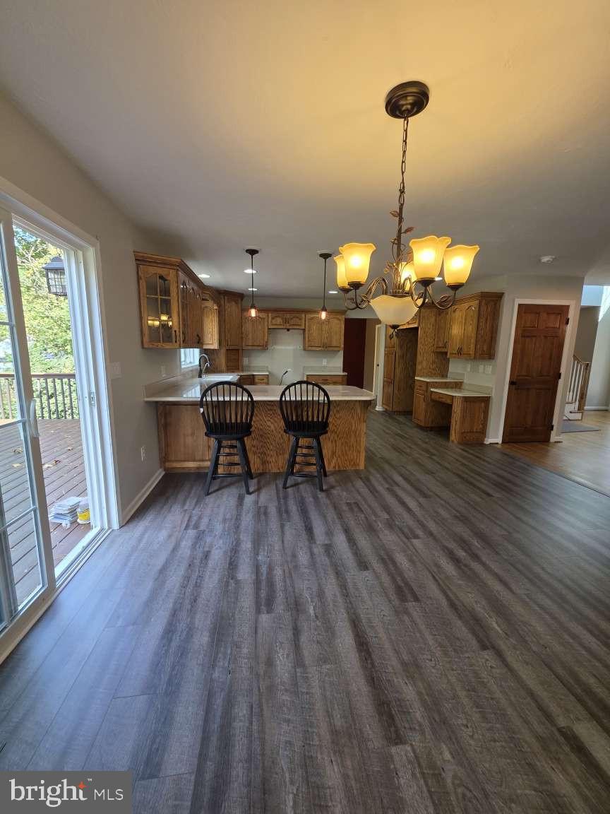798 Menges Mills Road Spring Grove, PA 17362 - Photo 18 of 50 a dining room with furniture a chandelier and wooden floor