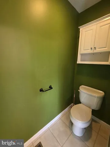 a bathroom with a toilet and a sink