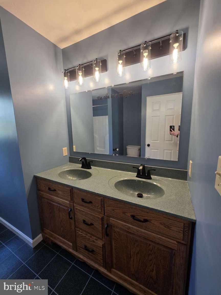 798 Menges Mills Road Spring Grove, PA 17362 - Photo 34 of 50 a bathroom with a granite countertop sink and a mirror