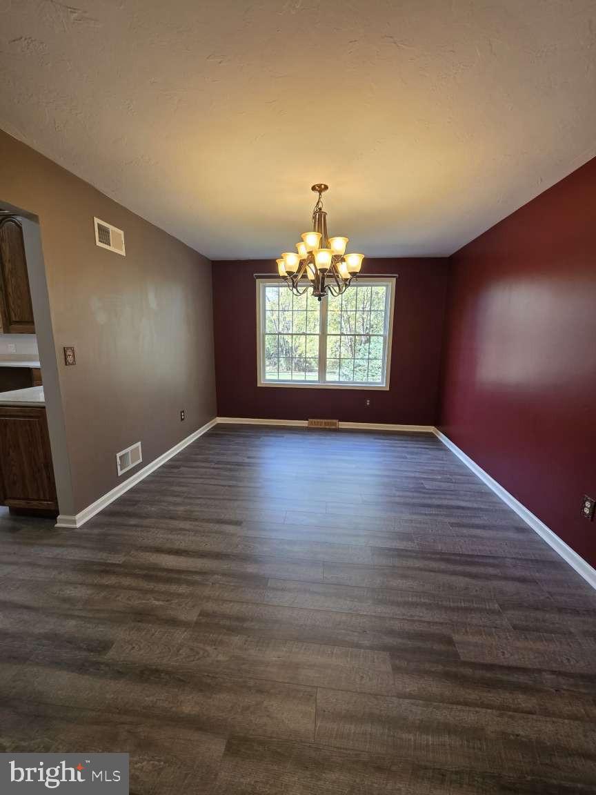 798 Menges Mills Road Spring Grove, PA 17362 - Photo 10 of 50 a view of room with wooden floor and chandelier
