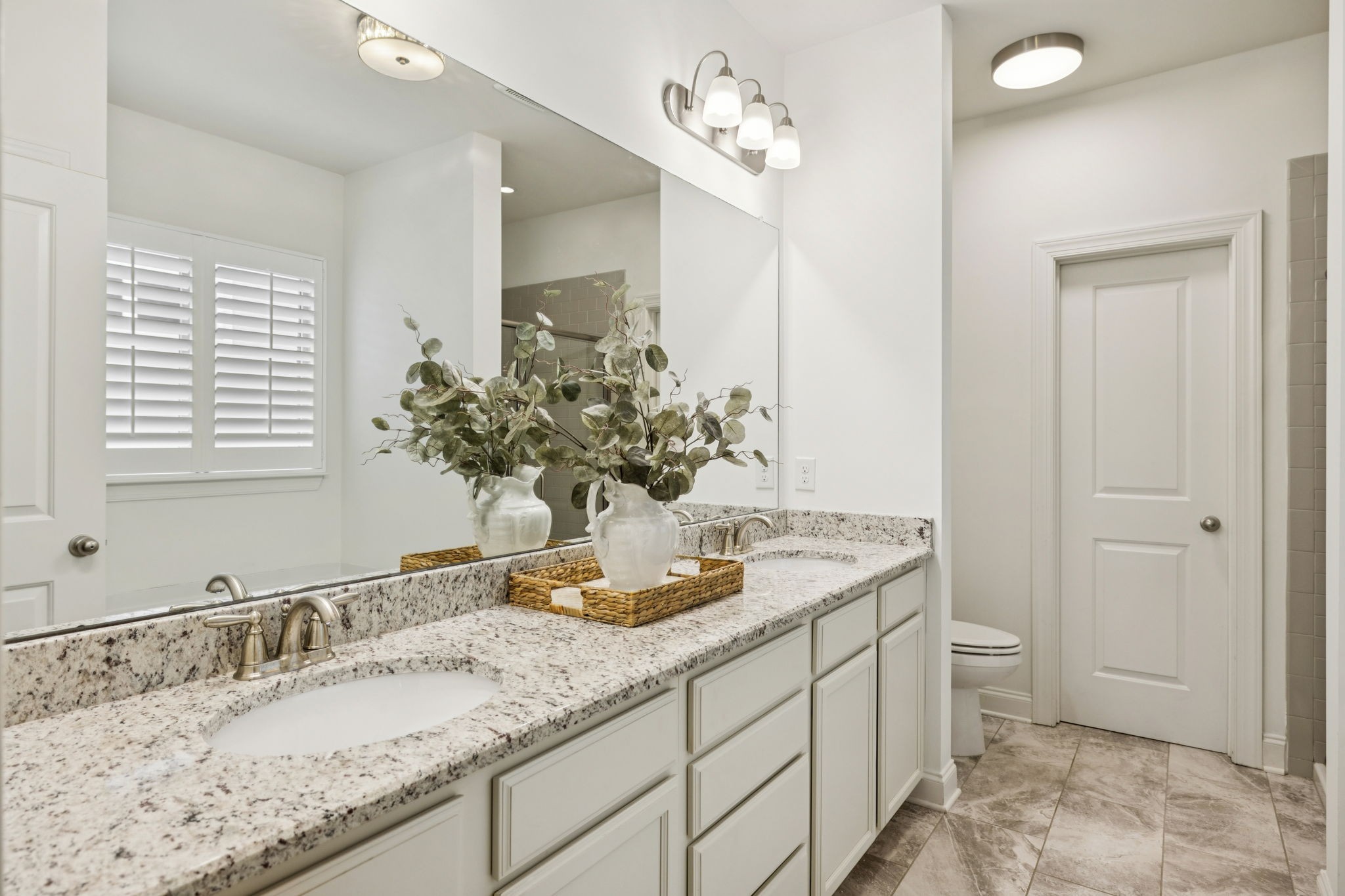 2000 Nolencrest Drive Franklin, TN 37067 - Photo 20 of 52 a bathroom with a granite countertop sink and a mirror