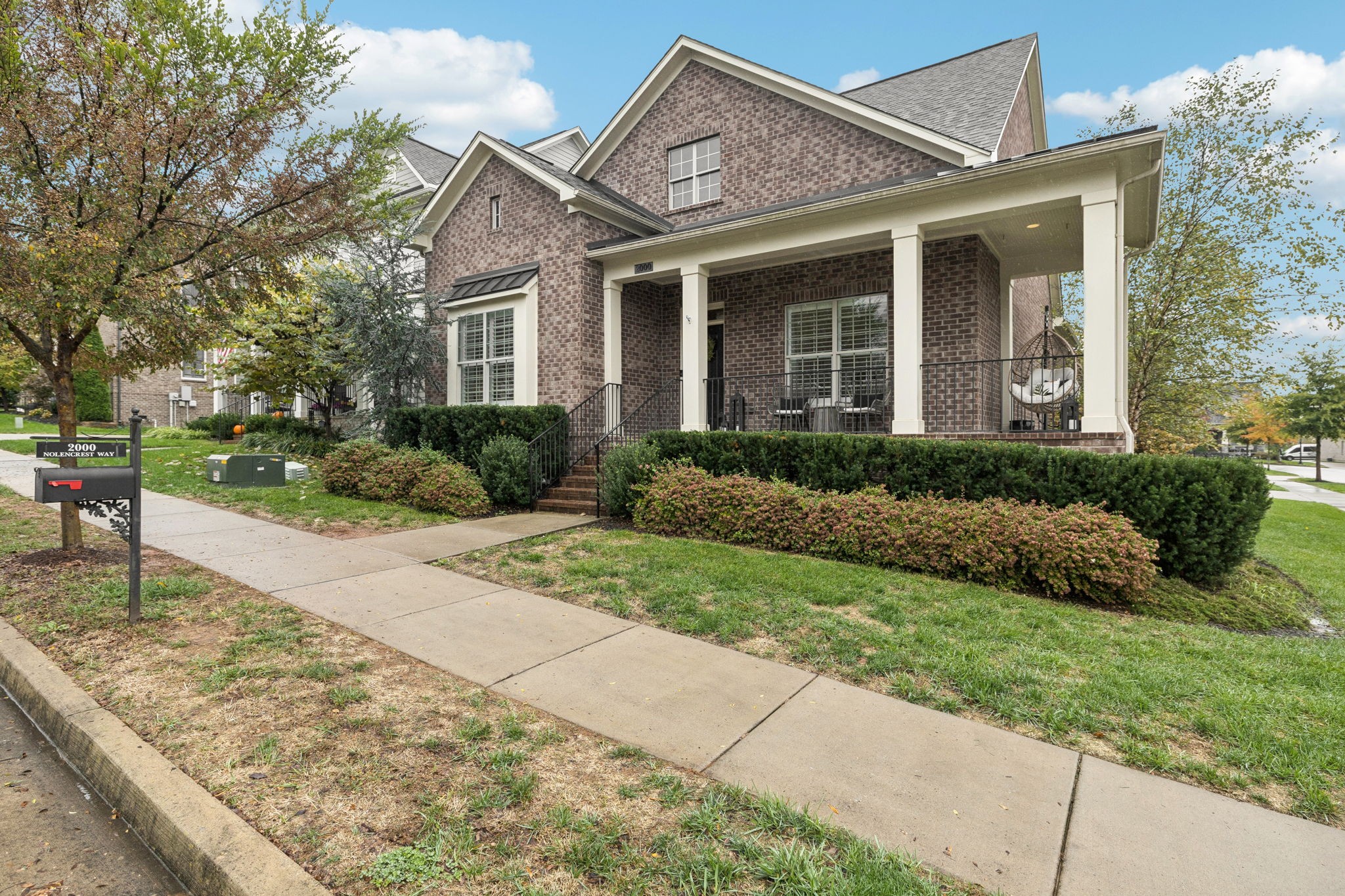 2000 Nolencrest Drive Franklin, TN 37067 - Photo 3 of 52 a front view of a house with garden