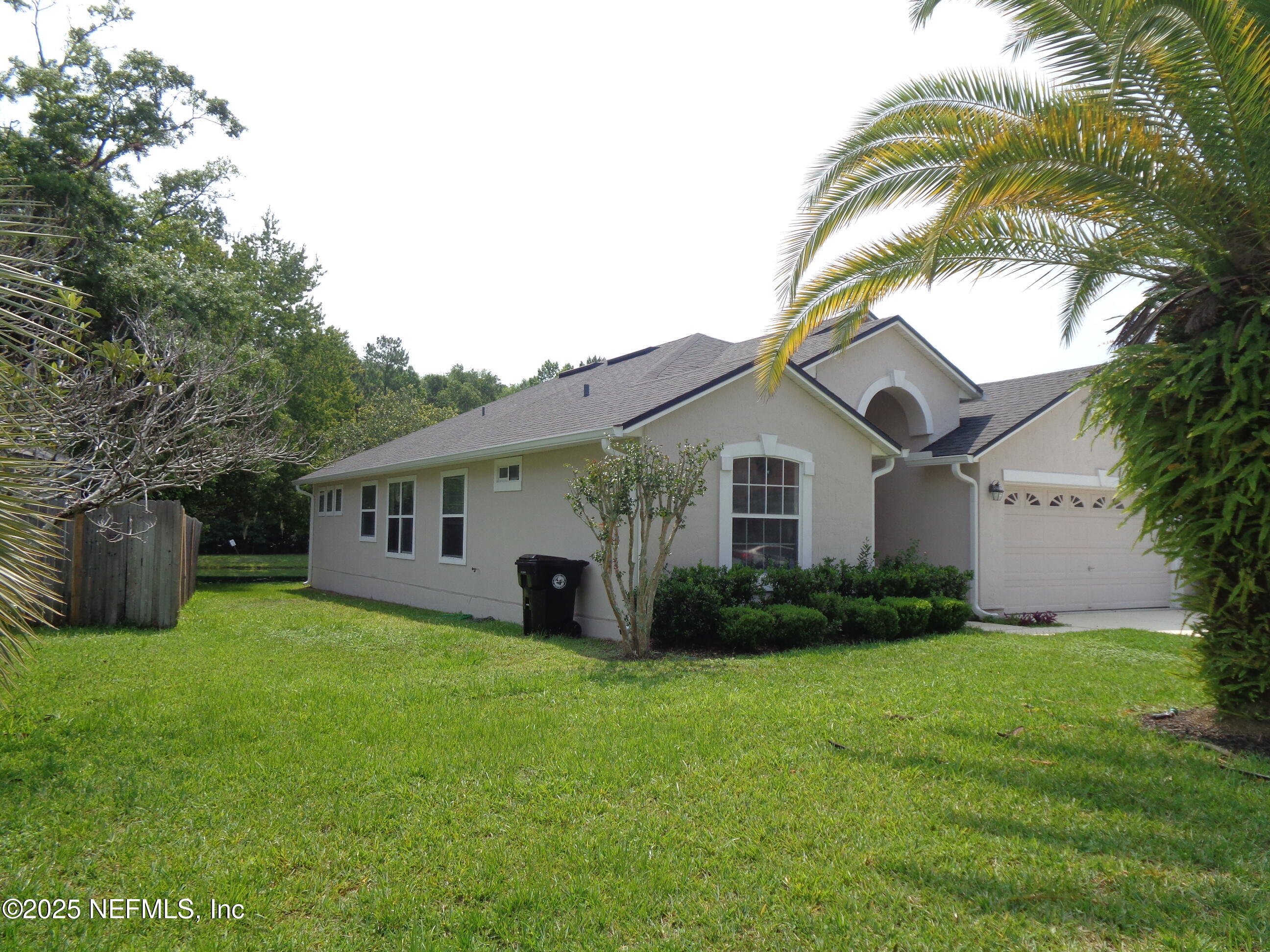 153 Dover Bluff Drive Orange Park, FL 32073 - Photo 2 of 18 a view of a yard in front of house