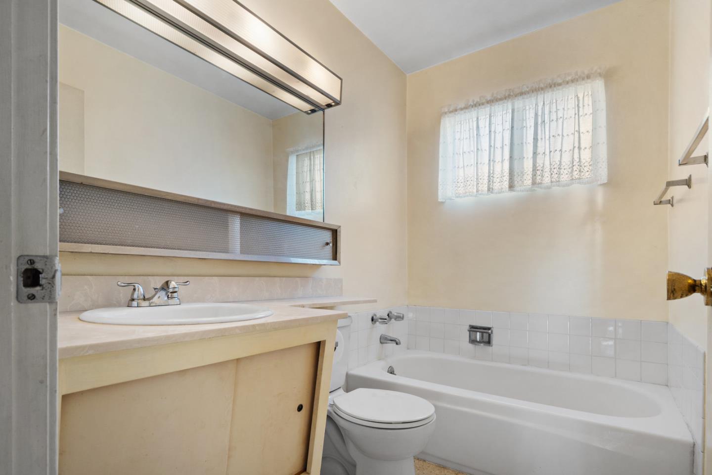 503 Paiute Lane San Jose, CA 95123 - Photo 11 of 18 a bathroom with a sink toilet vanity tub and shower