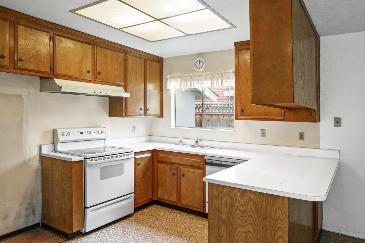 503 Paiute Lane San Jose, CA 95123 - Photo 5 of 18 a kitchen with a sink stove and cabinets