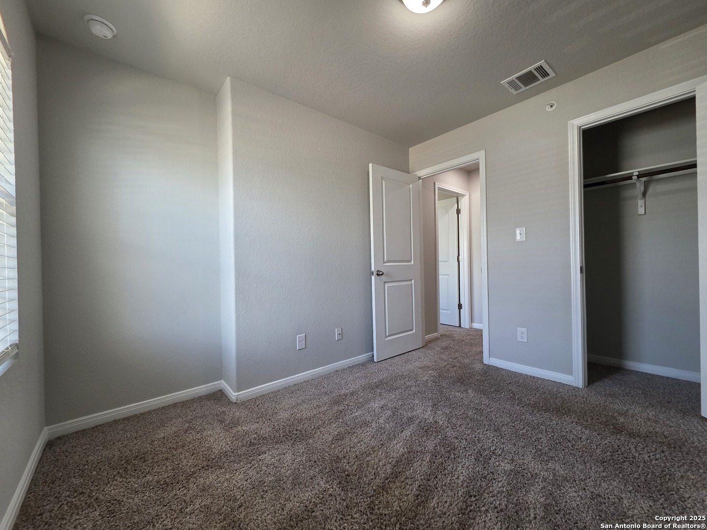 8410 Flicka Hills, Unit 2 Selma, TX 78154 - Photo 16 of 19 an empty room with closet area