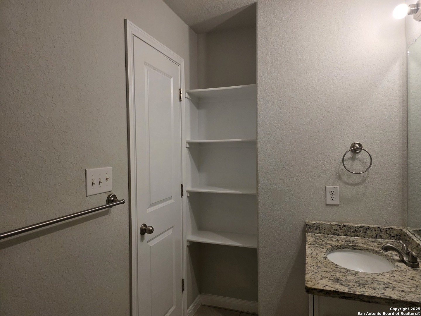 8410 Flicka Hills, Unit 2 Selma, TX 78154 - Photo 18 of 19 a bathroom with a granite countertop sink and shower