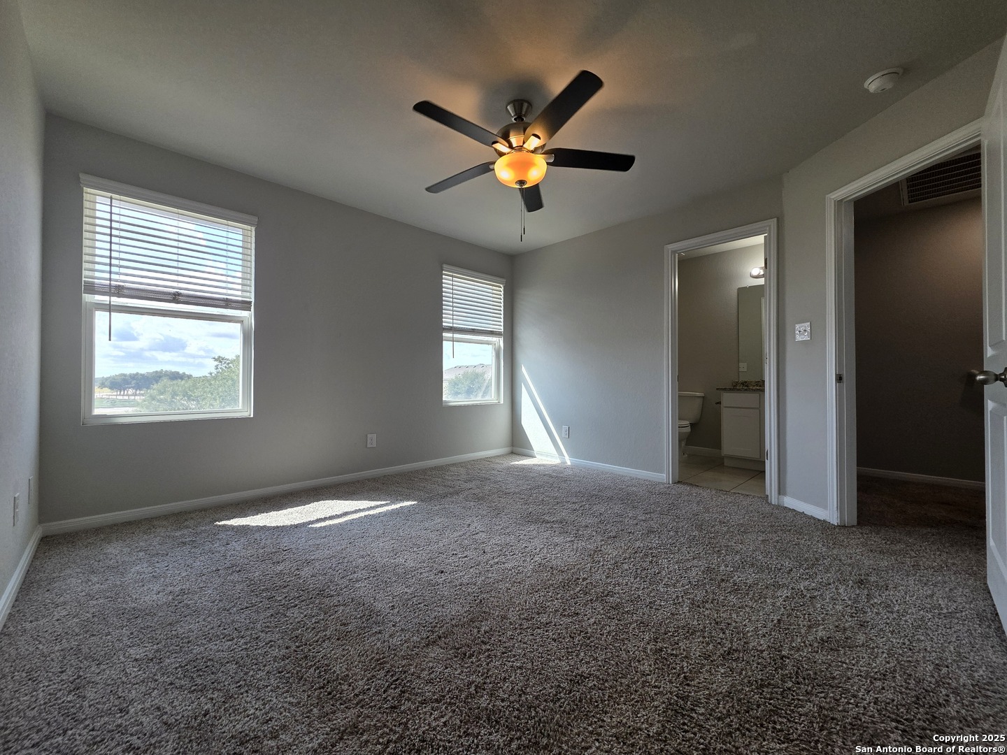 8410 Flicka Hills, Unit 2 Selma, TX 78154 - Photo 7 of 19 a view of a livingroom with a ceiling fan and window