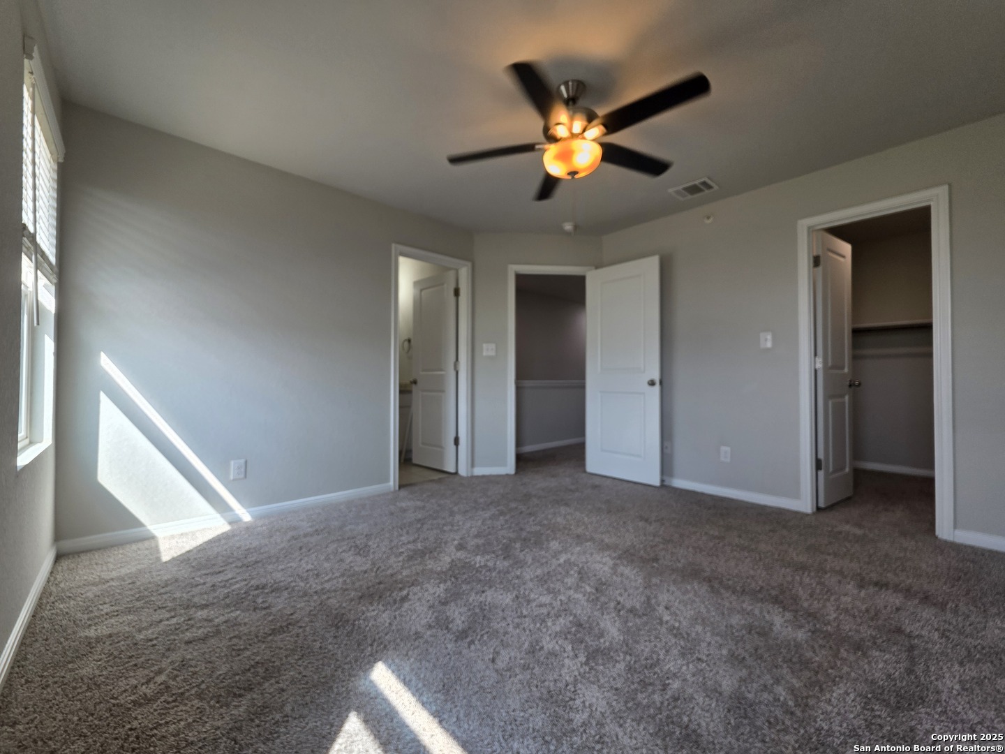 8410 Flicka Hills, Unit 2 Selma, TX 78154 - Photo 8 of 19 a view of an empty room with a chandelier fan