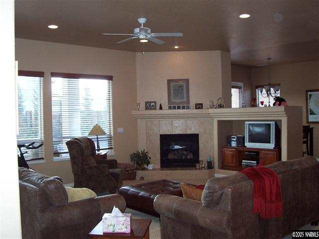 1680 Gulch Way Reno, NV 89521 - Photo 3 of 9 a living room with furniture and a fireplace