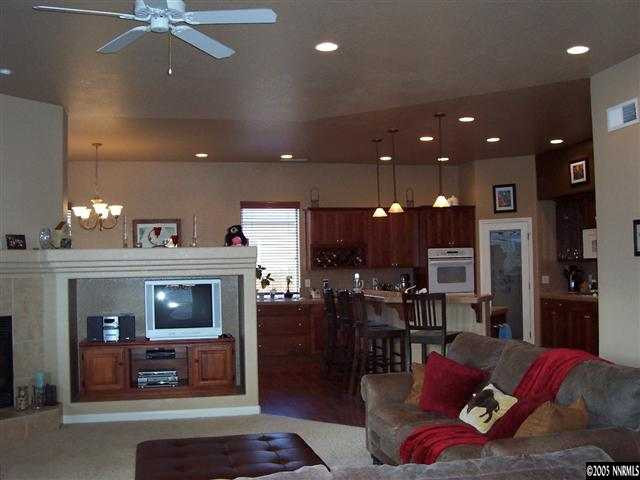 1680 Gulch Way Reno, NV 89521 - Photo 6 of 9 a living room with furniture and a fireplace