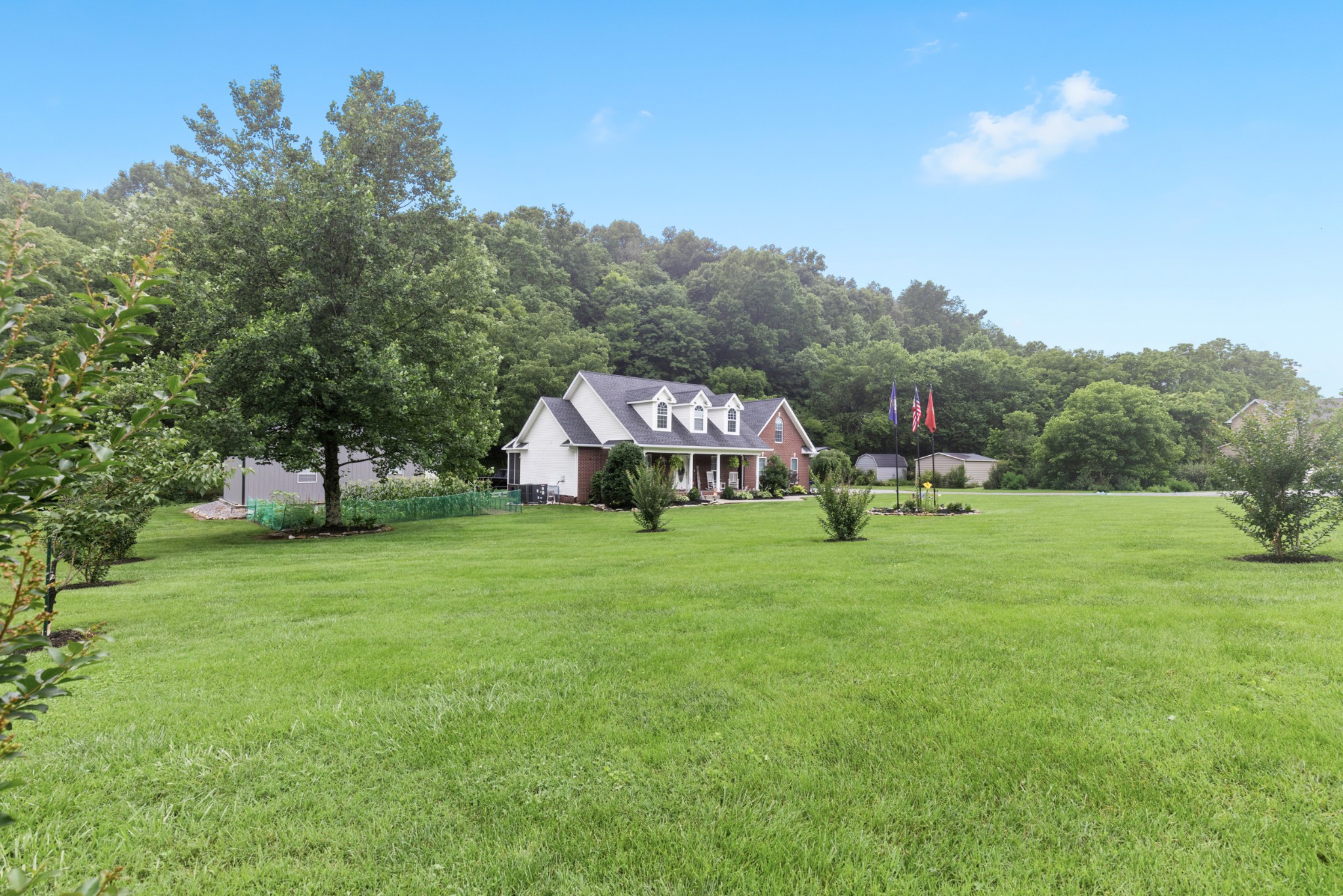 454 Campbell Hollow Road Bethpage, TN 37022 - Photo 6 of 57 a view of a house with a yard and sitting area