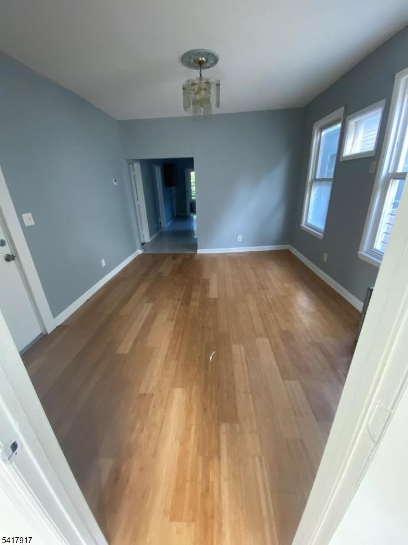 818 South 18th Street, Unit 2 Newark, NJ 07108 - Photo 9 of 12 a view of empty room with wooden floor