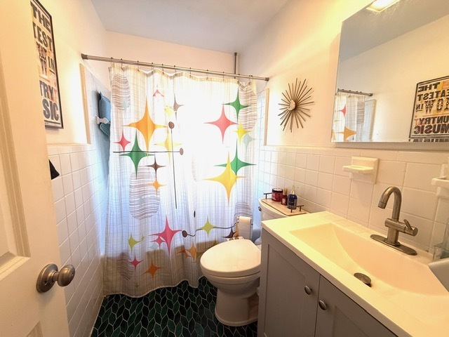 270 Andrassy Avenue Fairfield, CT 06824 - Photo 7 of 12 a bathroom with a sink toilet and shower