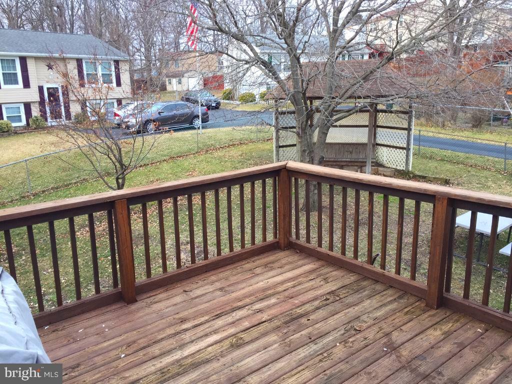 216 Compass Road Baltimore, MD 21221 - Photo 17 of 20 Large Rear Deck overlooks Fenced Rear Yard