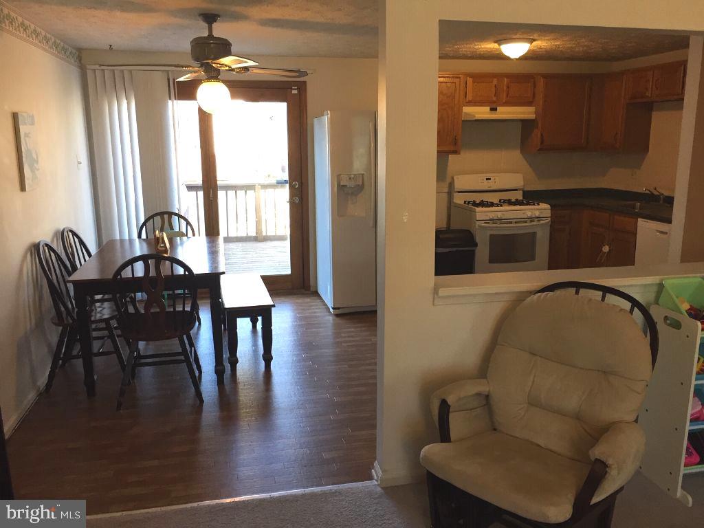 216 Compass Road Baltimore, MD 21221 - Photo 3 of 20 Dining Room with Walk-out to Rear Deck